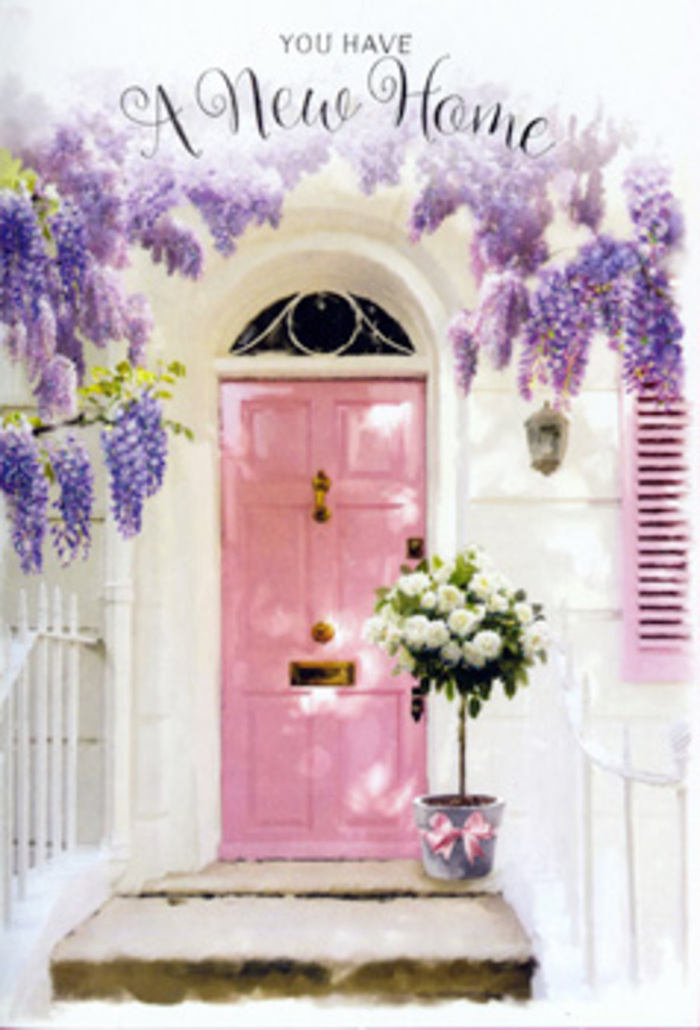 A tranquil Marylebone doorway becomes the stage for a tender housewarming moment, where colour, scent, and texture all work together to whisper, You're home now. The front door is painted a mellow blush pink, the kind of soft, comforting shade you might notice along the calm residential streets off Baker Street, and it is framed by clean white walls that bounce the light gently back into the scene. Overhead, wisteria tumbles down in waves of lavender and powdery purple, each raceme made up of countless tiny, pea-like flowers that collectively form a romantic canopy. The blooms hang loosely, creating shadows that dance across the door and lend the entryway a dreamy, storybook quality. Resting just by the threshold is a stylish grey metal bucket, weathered enough to feel authentic yet neat enough to sit proudly at the front step. It overflows with lush white and cream roses, the petals thick and velvety, curling back in soft spirals that draw the eye inward. Wisps of fresh greenery peek out between the roses, offering variation in shape and tone while maintaining the clean, elegant look. A wide pink satin ribbon encircles the bucket, tied in a bow that echoes the hue of the door and provides a gentle finishing touch. The light is soft, suggesting either late morning or early evening, and you can almost imagine the aroma of the wisteria mingling with the warm, creamy fragrance of the roses. The overall mood is hopeful, calm, and full of promise, perfectly capturing the emotion of moving into a new home in Marylebone and wanting the doorstep to feel instantly loved and lived in.